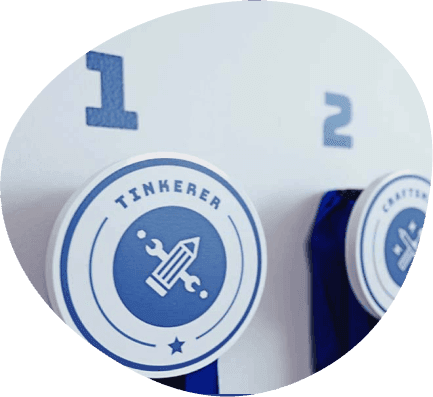 Two Steamoji level badges on a blue background